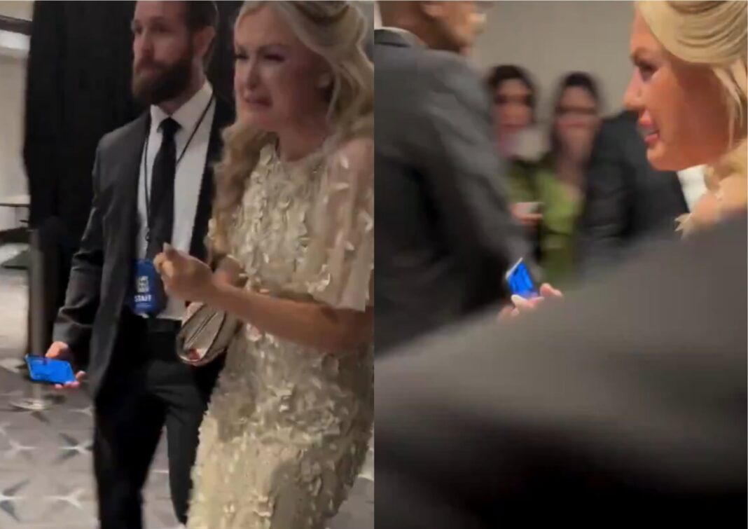 Erica Kirk, viuda de Charlie Kirk, siendo escoltada por seguridad durante la evacuación en el Hotel Hilton de Washington